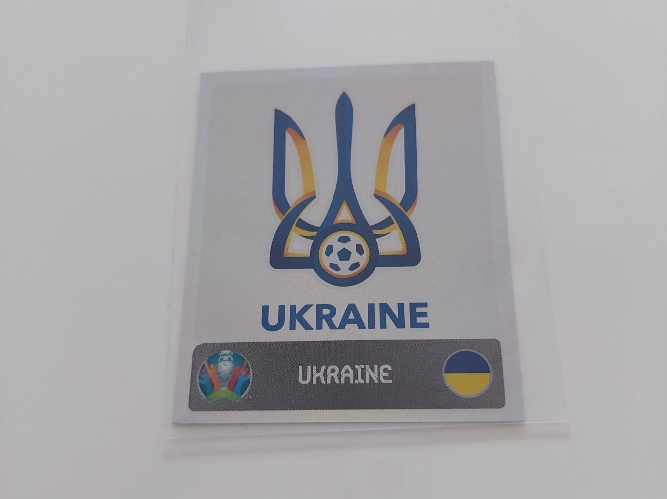 Panini Carte collezionabili: Ukraine Wappen/Logo Glitzerbild EM 2020 – Usato da Köniz venduto da Toyscollect