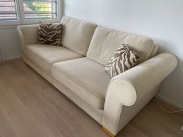 Beiges Sofa mit zwei Kissen guter Zustand