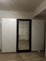 Wardrobe with three sliding doors 