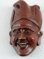 Schöne Maske aus edlem Holz. Fernost.
