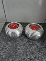 2 runde Kerzenhalter