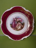 Porzellan Wandteller mit Amor und Frauen dunkelrotgold Rand