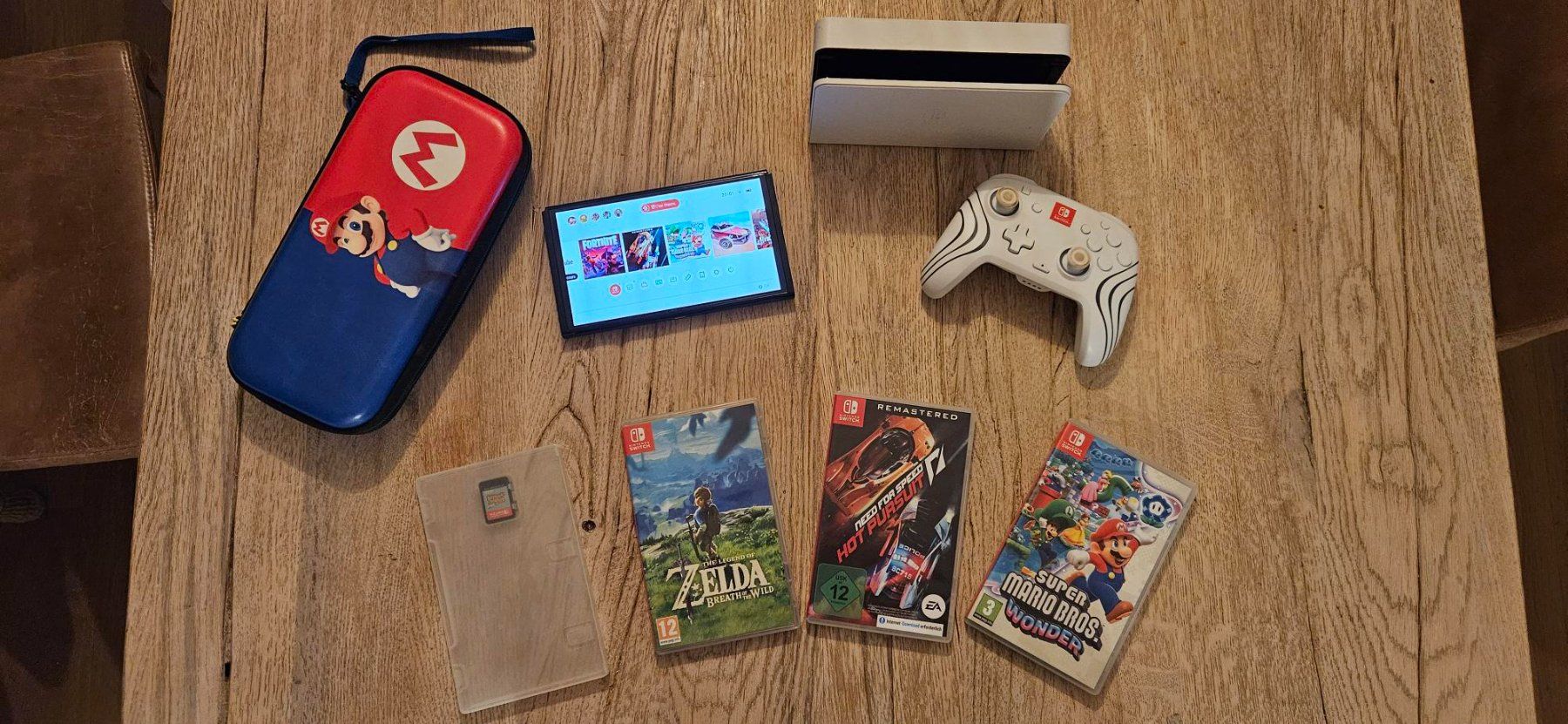 Console Switch OLED + 1 manette pro + 8 jeux (Gebraucht) in Vufflens-la ...