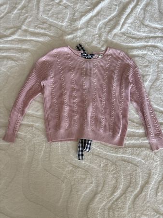 Pull rose clair avec des noeuds à carreaux, Taille S