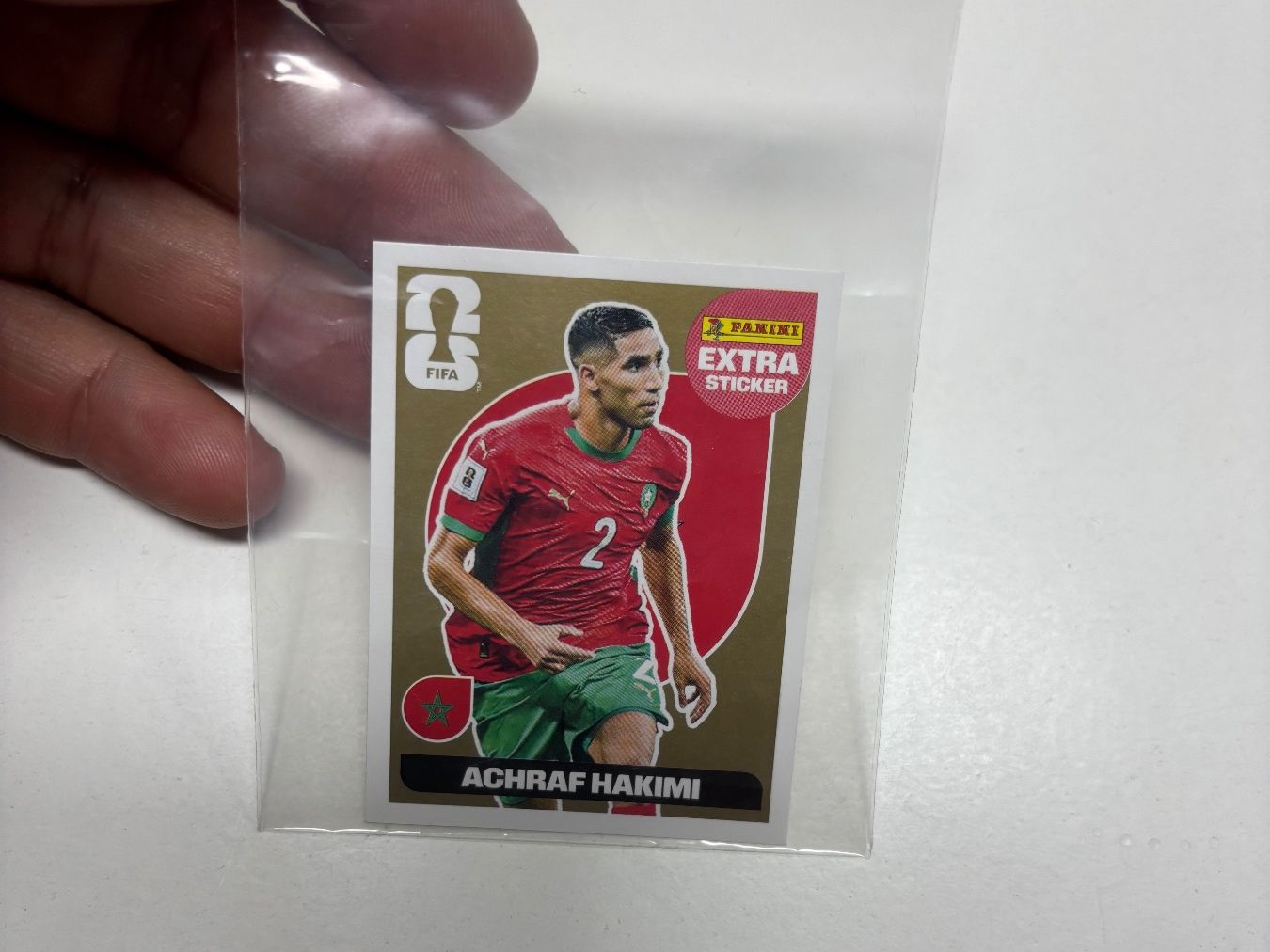 Panini Sammelbilder & Trading cards: Panini Extra Sticker Achraf Hakimi Gold World Cup 2026 – Gebraucht aus Pregassona von Roby17