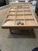 Table basse en bois et verre avec rangements