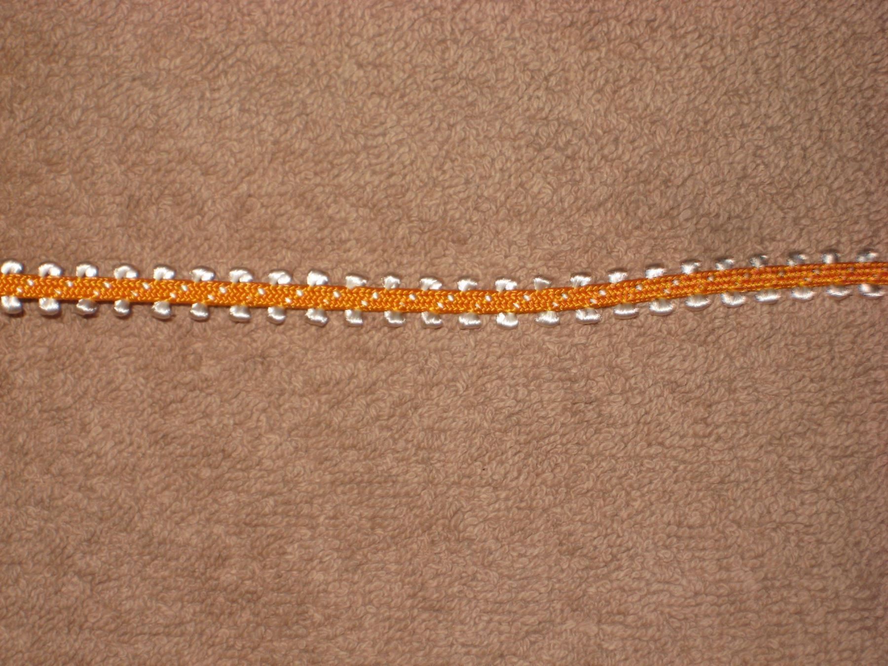 Nastri decorativi: Borte Polyamid orange / weiss 7mm breit Reststück! – Nuovo e nell'imballaggio originale da Füllinsdorf venduto da Schlupp 1