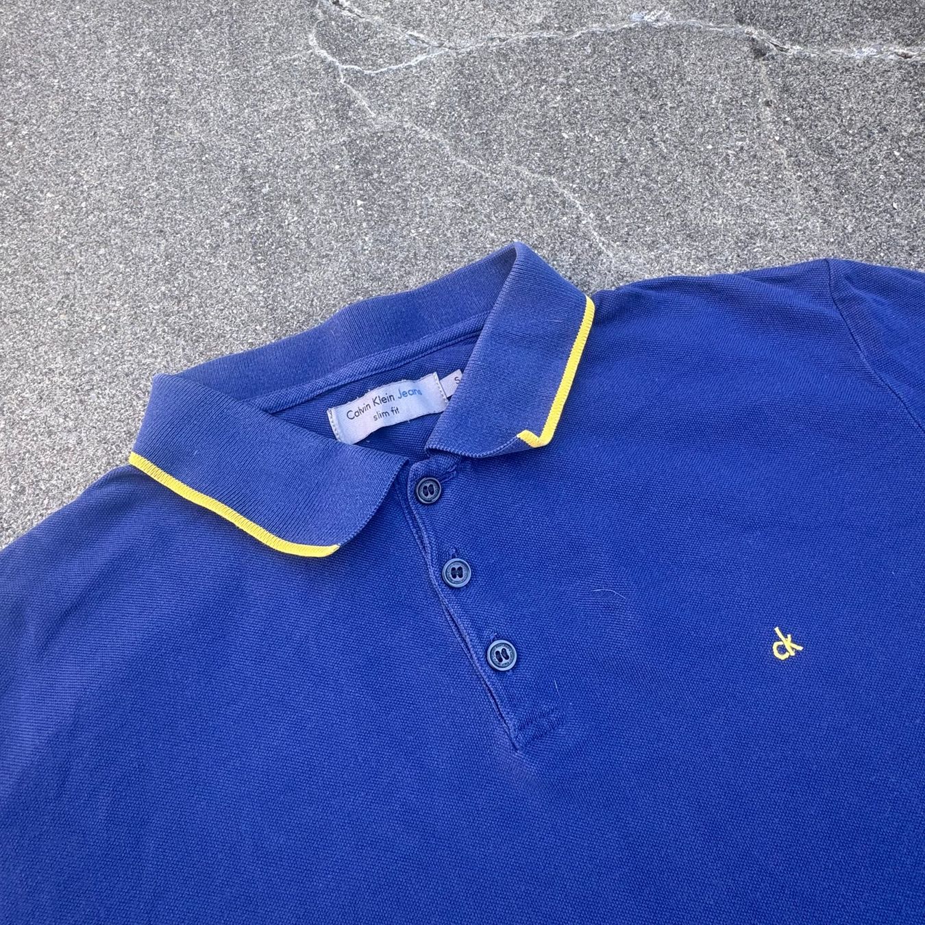 Calvin Klein Magliette Polo: Calvin Klein blue classic polo shirt – Usato da St. Gallen venduto da sourced_limited 1