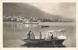 Locarno TI Lago Maggiore pescatori e battello Dampfschiff