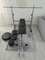 Hantelbank mit 75 kg Gewichten