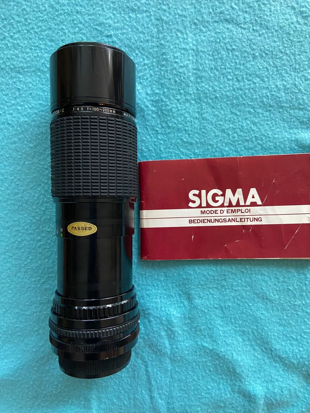 Sigma Obiettivi: Sigma Objektiv 1:4.5 100-200 mm multi coated d52 Anleitung – Usato da Altstätten SG venduto da Sportsonnenblume 1