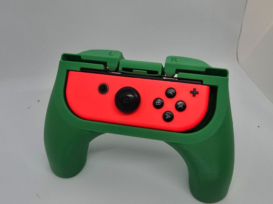 Nintendo Giochi: Ergonomische Joycon Griff Nintendo Switch – Nuovo e nell'imballaggio originale da Dietikon venduto da You_Want_We_Print 3