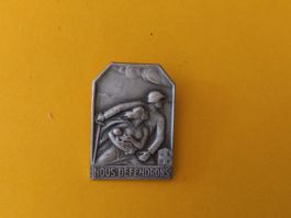 Médaille ancienne suisse en métal, Nous défendrons