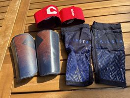 Kipsta Fussball Schienbeinschoner und Armbinden Set