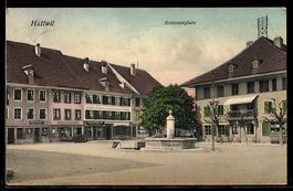 AK Huttwil, Brunnenplatz mit Geschäften