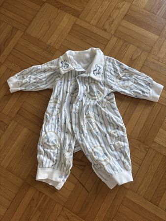 Combinaison bébé motifs rayures chevaux à bascule