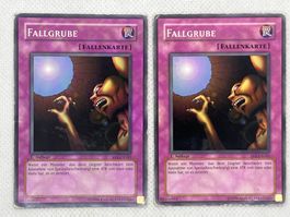 2 Yu-Gi-Oh Karten Fallgrube 1. Auflage SYE-DE041
