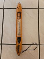 Thermometer in Webschiffchen