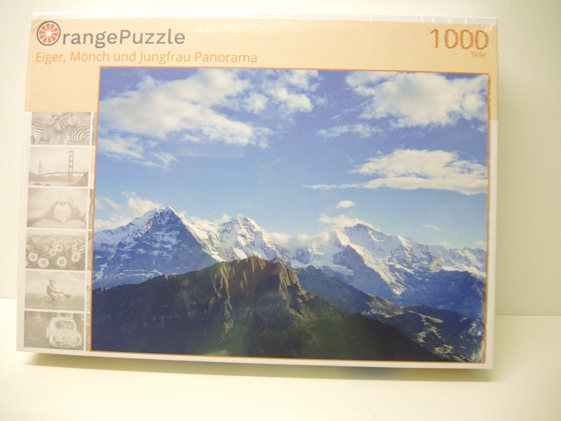 Puzzle: Orange 12 Eiger, Mönch und Jungfrau 1000 – Nuovo e nell'imballaggio originale da Dagmersellen venduto da FBM-Bacheli