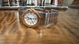 Montre femme Chopard St Moritz lunette or 18k et acier 