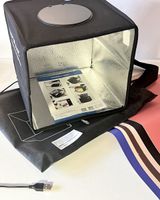 Faltbare Box mit LED Licht-Ring für kleine Fotoaufnahmen.