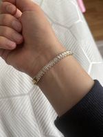 Goldfarbenes Armband mit Zirkonia Steinen, neuwertig.
