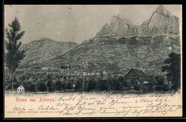 Künstler-AK Schwyz, Ortsansicht mit Kirche und Bergen