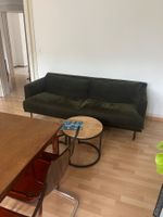 Dunkelgrünes Sofa