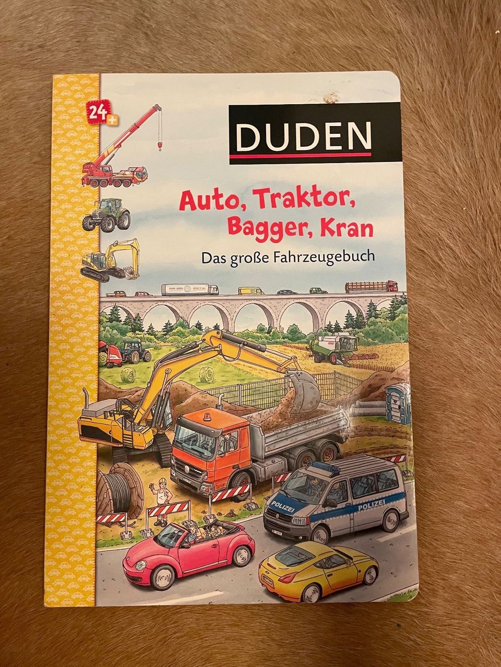 Livres: Duden Kinderbuch "Auto, Traktor, Bagger, Kran" – D'occasion à luzern par plueschmors.