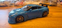 Spielzeugauto 2009 Nissan GT-R blau 1/24