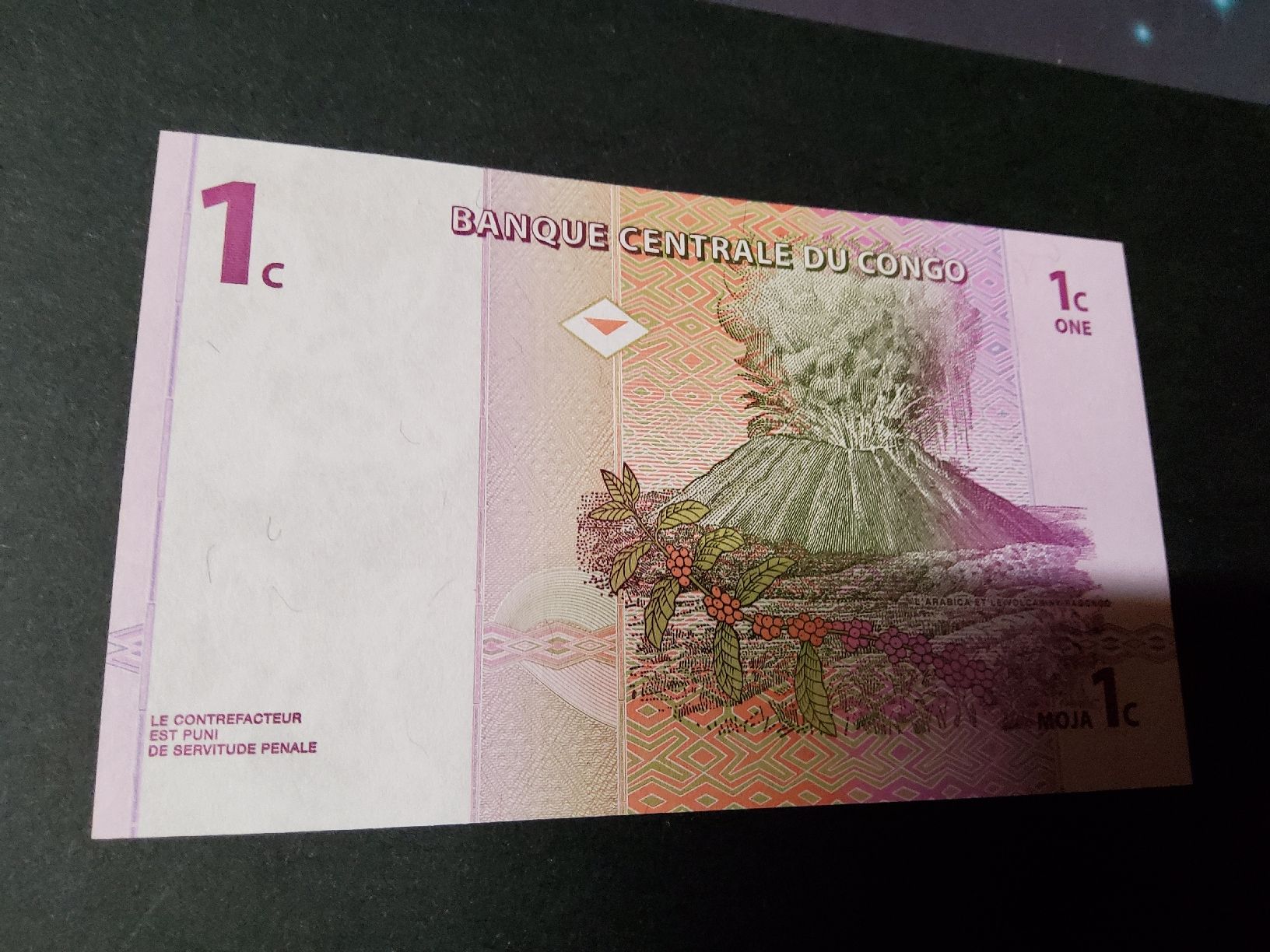 Banconote: Kongo 1 Centime 1997, Vulkan Nyiragongo, seltener Schein – Nuovo e nell'imballaggio originale da Herisau venduto da Nluanalucas 1