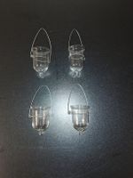 Vier Teelichthalter aus Glas