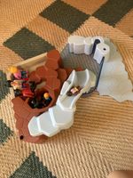Playmobil figures and mountain swimming pool