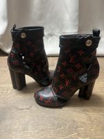 Bottines Louis Vuitton cuir noir rouge état d'usage