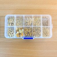 Schmucksortierbox mit Zubehörteilen goldfarben