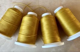 Overlock Faden 4 Spulen Pauschgarn goldgelb