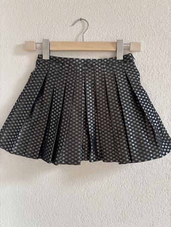 Jupe plissée à pois noirs et argentés taille 6-7 ans