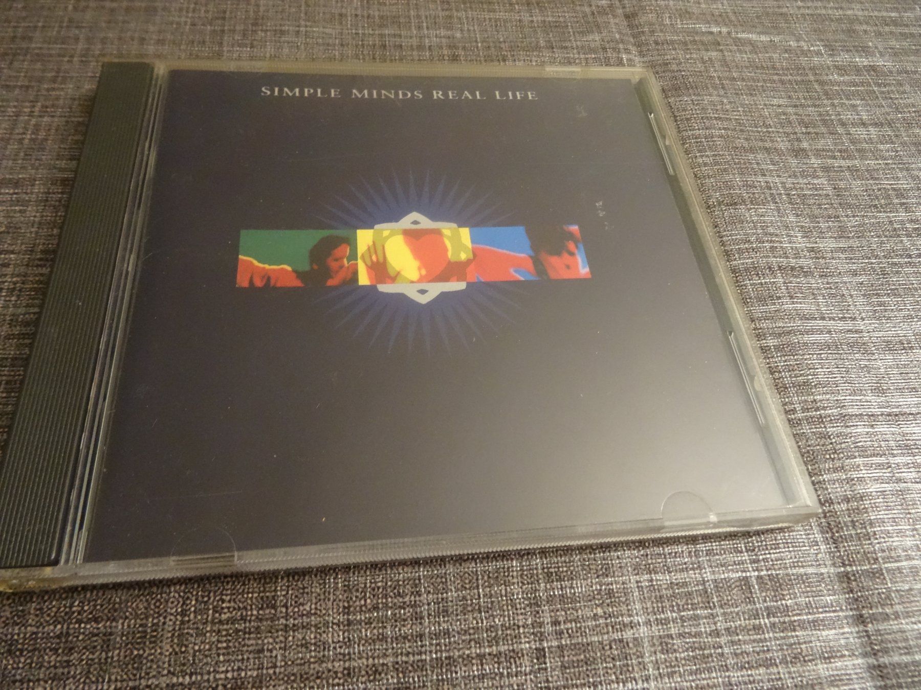 CD: Simple Minds - Real Life CD – Usato da Olten venduto da Disc-Ausverkauf