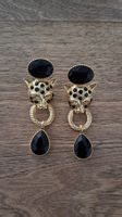 très belle boucles d'oreilles panthère pierres noires