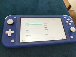 Nintendo Switch Lite blau mit Tasche und Spielen