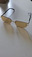 Sonnenbrille goldfarbig randlos getönt neu