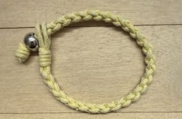 Armband geflochten gelb mit Kugel neuwertig