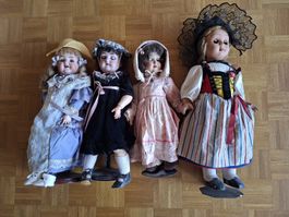 4 antike Puppen Porzellan usw. gem. Bilder