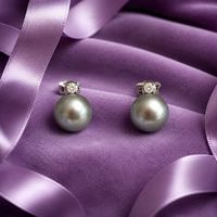 Südsee-Grauperlen-Ohrringe mit Diamanten 0.40 750/18K