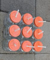 Henkel-Glas mit Strohhalm