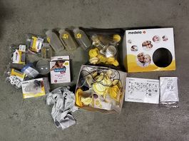 Medela Milchpumpe mit viel Zubehör. 