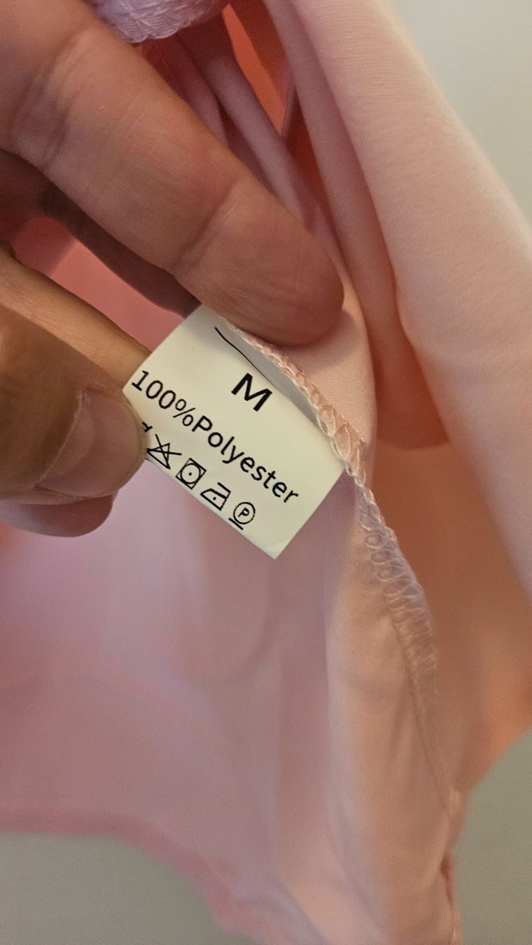 Top: Top canotta rosa chiaro tg.M poliestere – Usato da Melano venduto da H-Sara 2