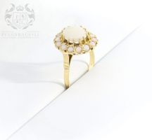 LIEBENSWERTER RING AUS 14K GOLD MIT MILCHOPALEN