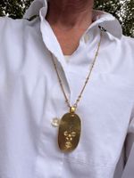 Halskette mit Gesicht goldfarben gebraucht