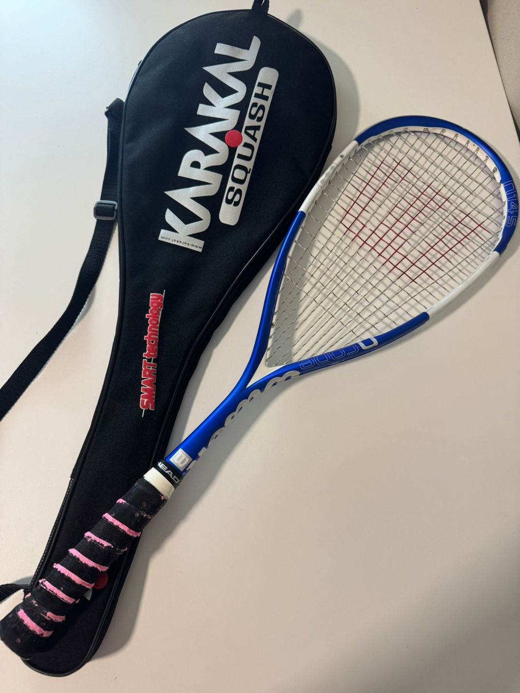 Raquette de squash Wilson NCoDE N145 blanche et bleue